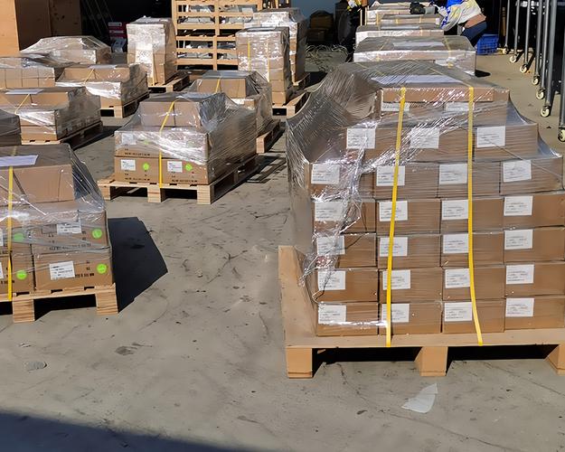 Palletised and shrink-wrapped export cartons labelled for international shipment